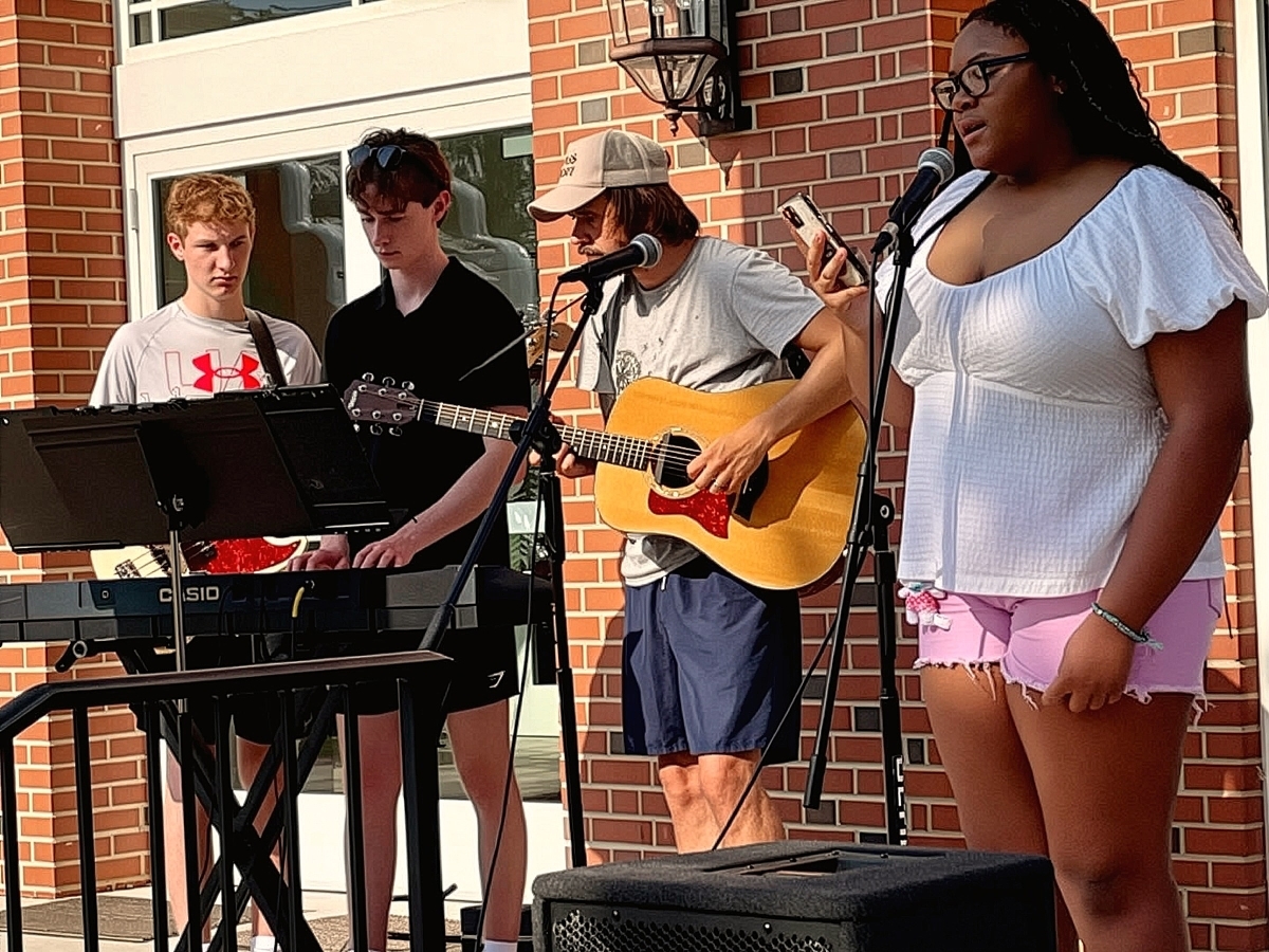 Students playing instruments during youth worship rehearsal
