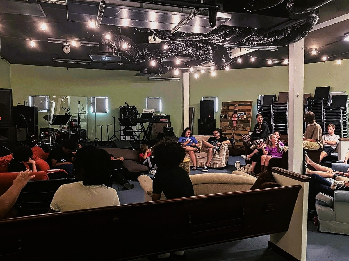The Attic youth space with students and leaders