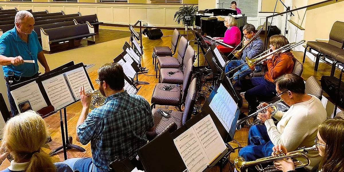 Keith leading music rehearsal